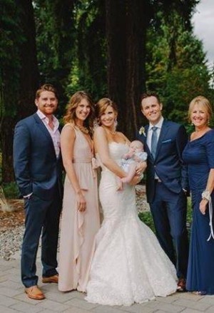 Lorriane's mom and husband Mark are reflected in the eyes of her children Tyler (right) Chelsea (left).Pictured with spouses Hayley and Kevin and first grand baby Bowen